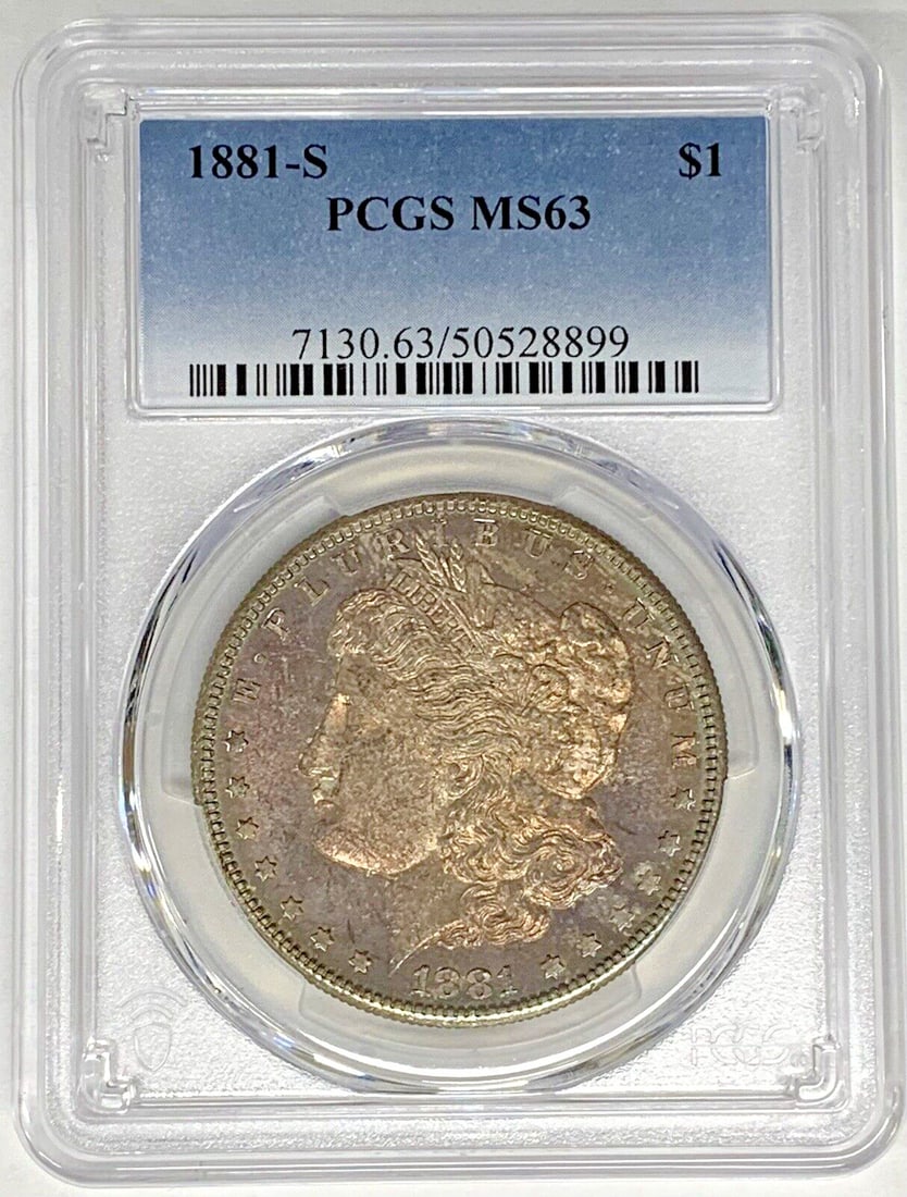 PCGS MS 63 Morgan Dollar 1881-S Silver Coin with Colorful Toning: PCGS MS 63 Morgan Dollar 1881-S Silver Coin with Colorful Toning This 1881-S Morgan Silver Dollar features a colorful tone and has been graded MS 63 by PCGS. Struck in the United States, this uncircul