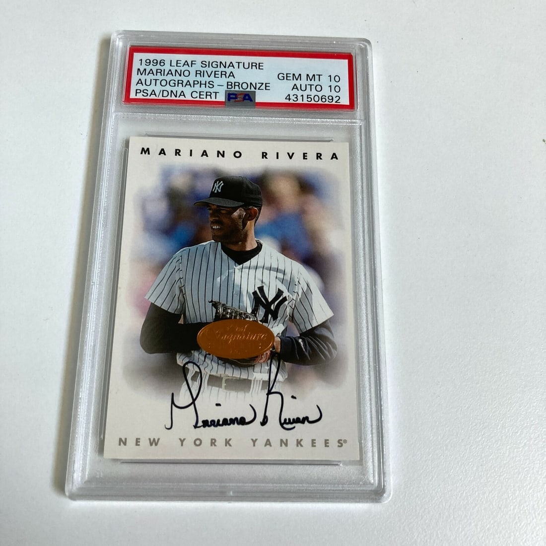 1996 Leaf Mariano Rivera Rookie Card PSA GEM MINT 10 Autographed: 1996 Leaf Mariano Rivera Rookie Card PSA GEM MINT 10 Autographed This 1996 Leaf Signature rookie card features the legendary Mariano Rivera, graded GEM MINT 10 by PSA for both the card and the autogra