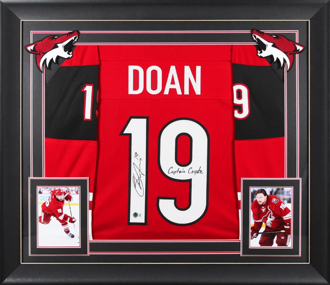 Shane Doan Signed Red Framed Jersey with Captain Coyote Inscription BAS Authenticated: Shane Doan Signed Red Framed Jersey with Captain Coyote Inscription BAS Authenticated This stunning red pro-style framed jersey celebrates Shane Doan, known as "Captain Coyote" of the Arizona Coyotes.
