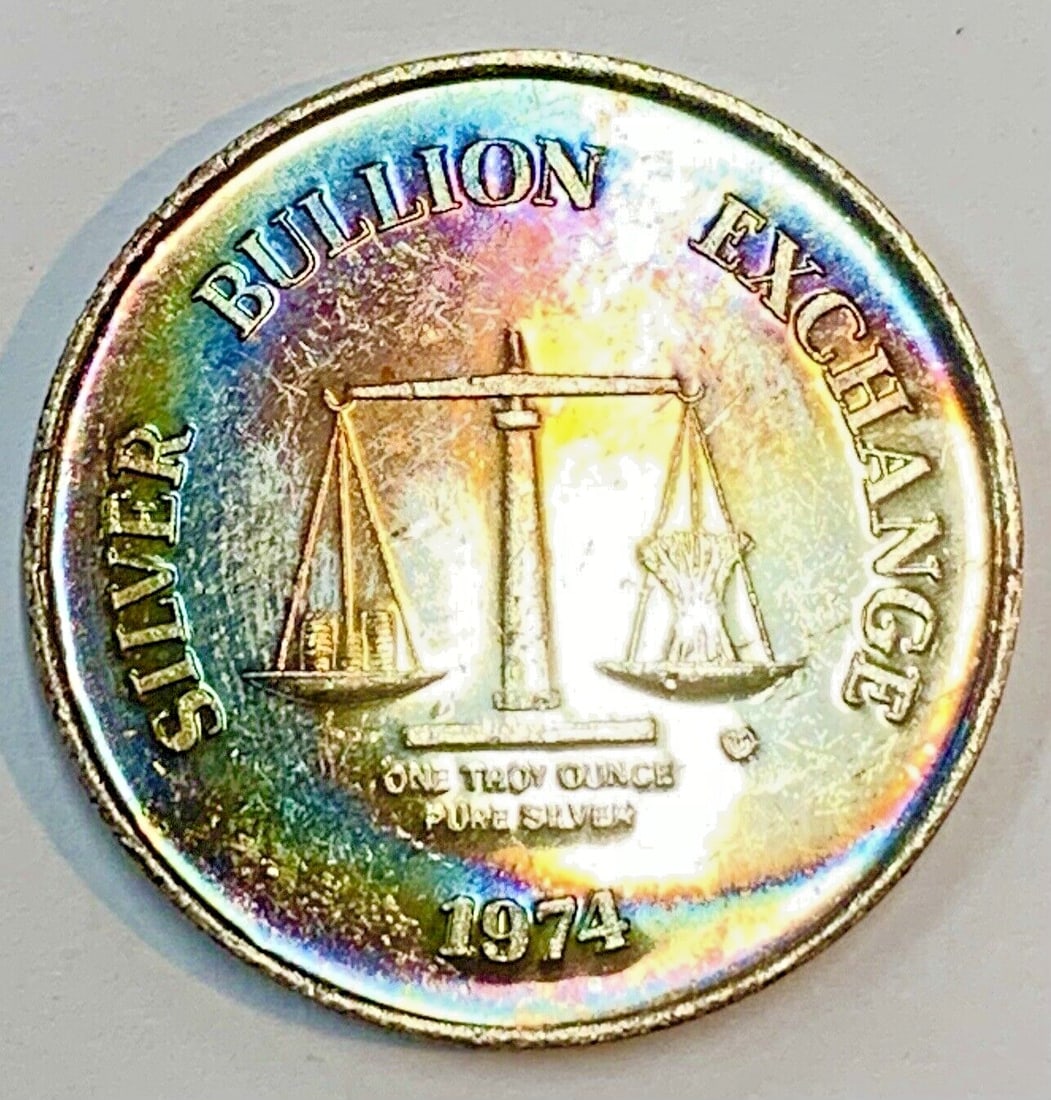 1 oz 1974 Silver Bullion Exchange Rainbow Tone Uncirculated Coin: 1 oz 1974 Silver Bullion Exchange Rainbow Tone Uncirculated Coin This 1974 vintage Silver Bullion Exchange coin features a rainbow tone and is composed of 1 ounce of .999 silver. The coin is uncircula