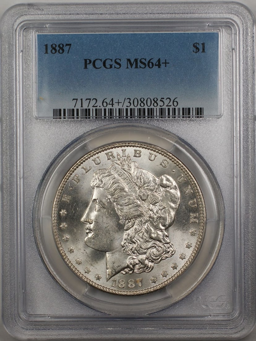 PCGS MS-64 Plus 1887 Morgan Silver Dollar Philadelphia Mint: PCGS MS-64 Plus 1887 Morgan Silver Dollar Philadelphia Mint This is an 1887 Morgan Silver Dollar $1 coin, graded MS-64+ by PCGS. Struck in Philadelphia, this uncirculated silver coin is a collectible