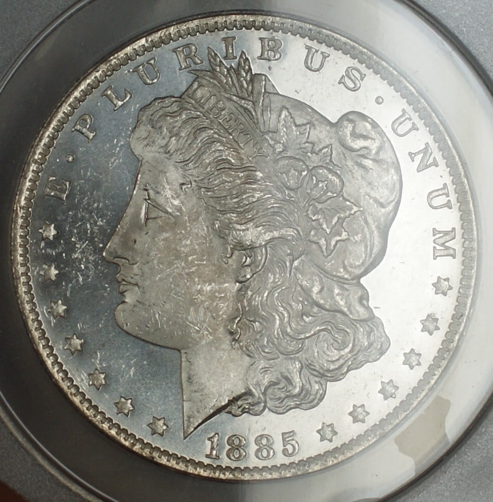 ANACS MS63 PL 1885-O Morgan Dollar Silver Coin New Orleans Mint: ANACS MS63 PL 1885-O Morgan Dollar Silver Coin New Orleans Mint This is an 1885-O Morgan Silver Dollar coin graded MS-63 Proof-Like by ANACS. Minted in New Orleans, this uncirculated silver dollar fea