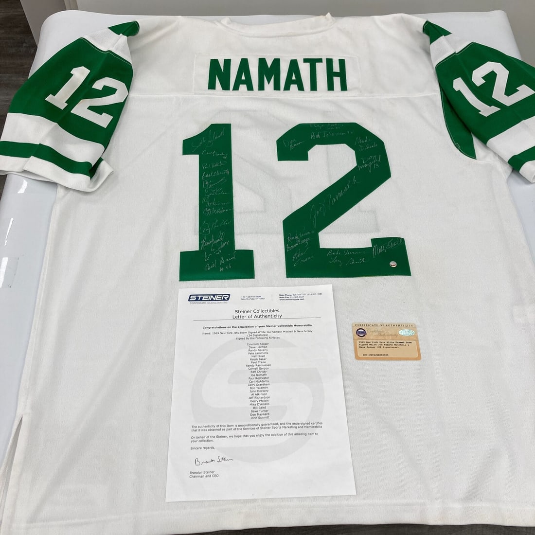 1969 New York Jets Team Signed Jersey Joe Namath 24 Signatures Steiner COA: 1969 New York Jets Team Signed Jersey Joe Namath 24 Signatures Steiner COA Celebrate football history with this authentic 1969 New York Jets Super Bowl Champions Team Signed Jersey. This stunning piec