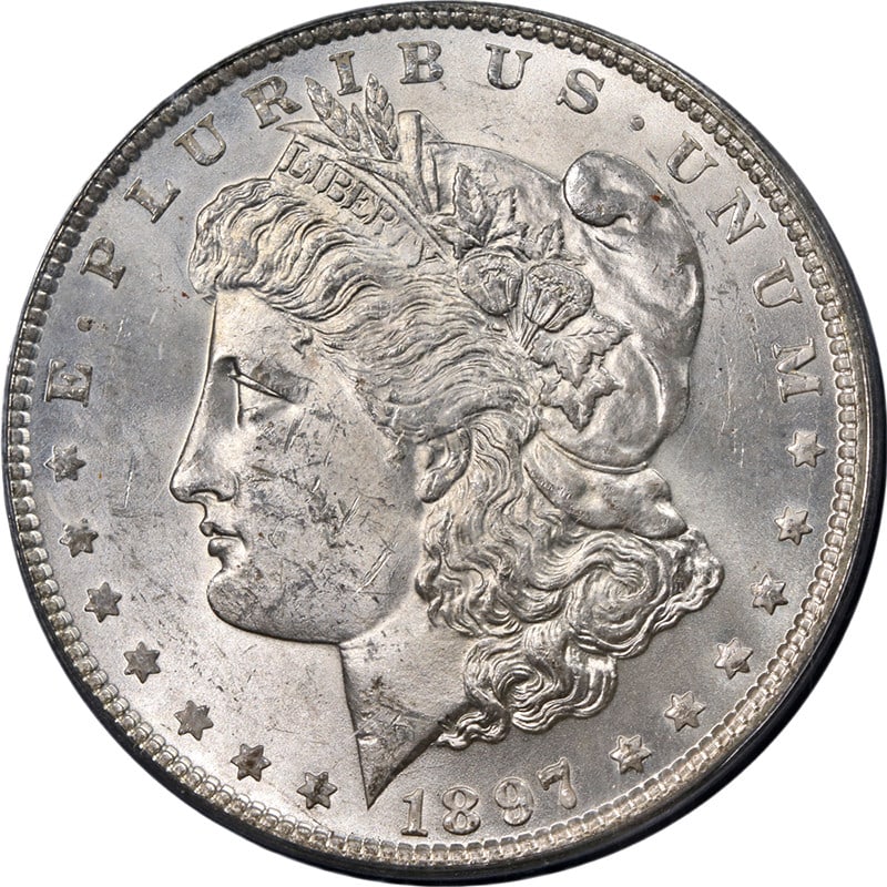 1897-P Morgan Silver Dollar PCGS MS63 Strong Strike Silver Coin: 1897-P Morgan Silver Dollar PCGS MS63 Strong Strike Silver Coin This original 1897-P Morgan Silver Dollar is a stunning example of American coinage, featuring a bright white finish and impressive lust