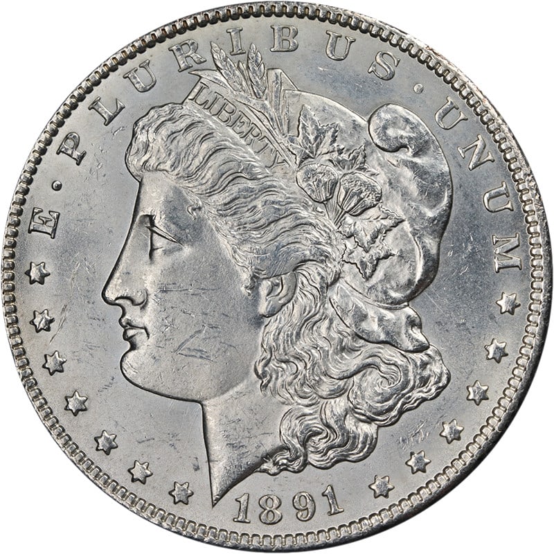 1891-CC Morgan Silver Dollar Uncirculated 90% Silver Attractive Design: 1891-CC Morgan Silver Dollar Uncirculated 90% Silver Attractive Design This 1891-CC Morgan Silver Dollar showcases exceptional eye appeal with a bright white finish and impressive luster. The coin is