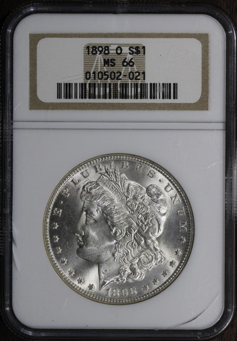 1898-O NGC MS66 Morgan Silver Dollar Blast White Coin: 1898-O NGC MS66 Morgan Silver Dollar Blast White Coin This stunning 1898-O Morgan Silver Dollar is graded MS 66 by NGC, showcasing its exceptional quality and brilliant white luster. Struck in silver
