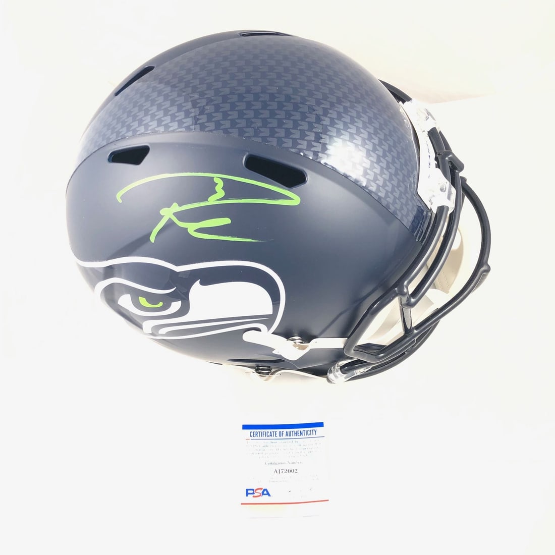 Russell Wilson Autographed Full Size Speed Helmet PSA/DNA Seahawks: Russell Wilson Autographed Full Size Speed Helmet PSA/DNA Seahawks This is a full-size Speed replica helmet autographed by NFL star Russell Wilson, showcasing his signature prominently. The autograph