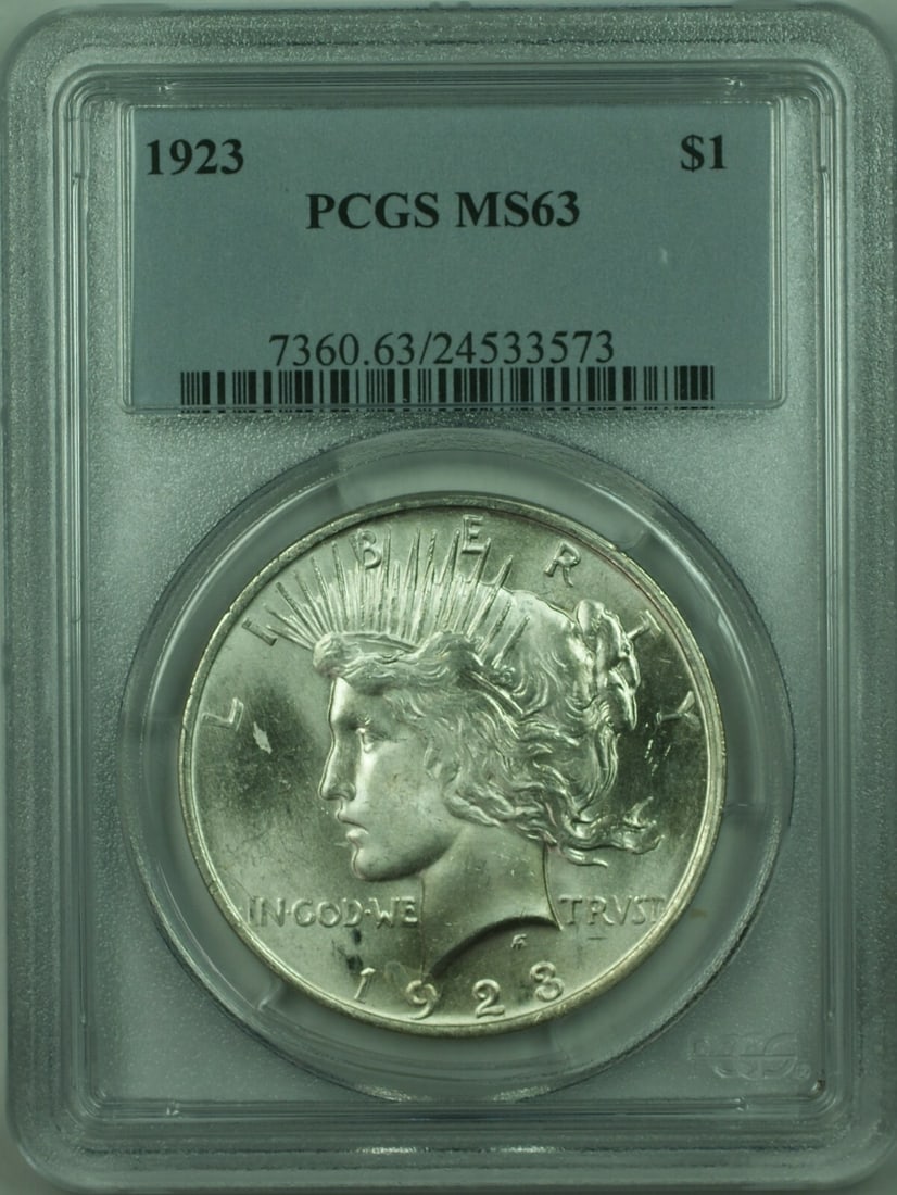 1923 Peace Dollar Silver Coin Certified MS 63 by PCGS Philadelphia Mint: 1923 Peace Dollar Silver Coin Certified MS 63 by PCGS Philadelphia Mint This 1923 Peace Silver Dollar $1 coin is certified by PCGS with a grade of MS 63. Minted in Philadelphia and composed of silver,