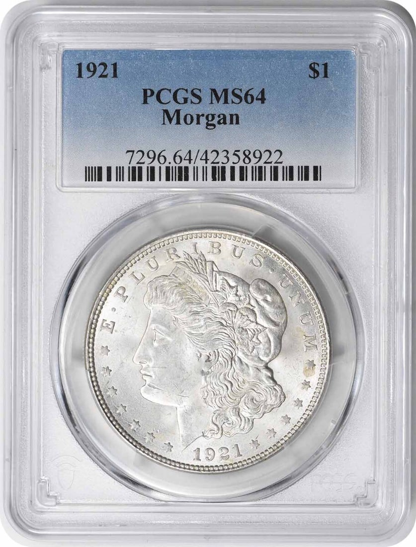 1921 Morgan Silver Dollar MS64 PCGS Uncirculated 90% Silver: 1921 Morgan Silver Dollar MS64 PCGS Uncirculated 90% Silver This 1921 Morgan Silver Dollar, graded MS64 by PCGS, is a remarkable collectible coin that showcases exquisite craftsmanship. The coin featu