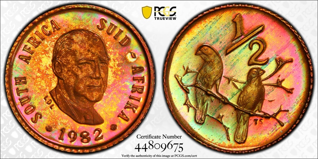 1982 South Africa Proof Half Cent PR65RB PCGS Monster Toning: 1982 South Africa Proof Half Cent PR65RB PCGS Monster Toning This 1982 South Africa Half Cent (1/2C) boasts a stunning proof quality with a PR 65 grade, certified by PCGS. Crafted from copper with a f