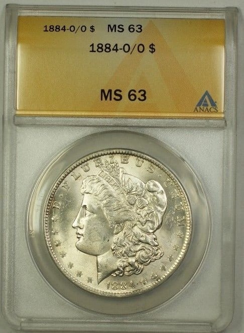ANACS MS 63 1884 O Over O Morgan Dollar Silver Coin Uncirculated: ANACS MS 63 1884 O Over O Morgan Dollar Silver Coin Uncirculated This 1884-O/O Morgan Silver Dollar is an uncirculated coin graded MS-63 by ANACS. It features an over mint mark from the New Orleans Mi