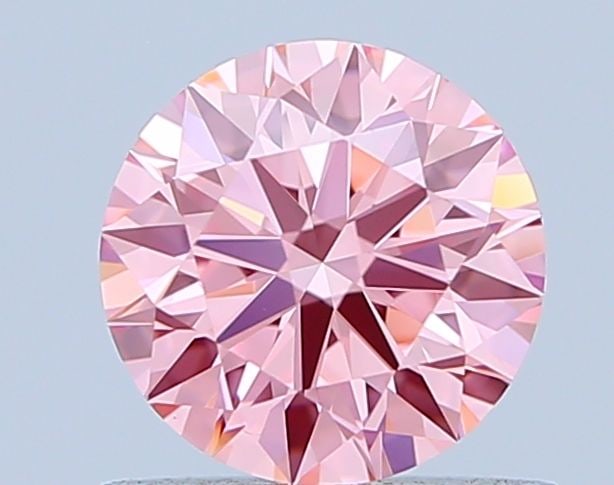 Ideal Loose Diamond - ROUND 0.76ct Fancy Vivid Pink VVS2: Ideal Loose Diamond - ROUND 0.76ct Fancy Vivid Pink VVS2 Source: This is a real non-mined Diamond that has been grown in a lab Shape: ROUND Carats: 0.76 Color: Fancy Vivid Pink Certification: IGI Vide