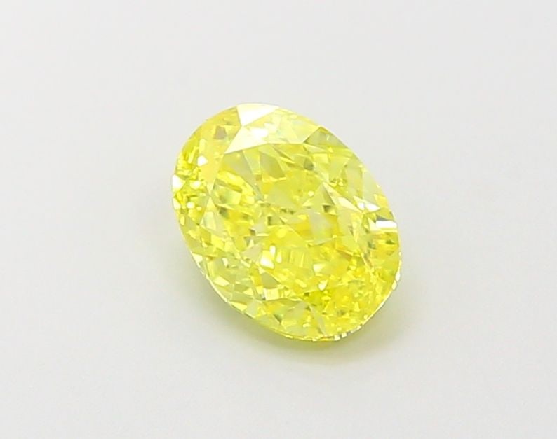 Loose Diamond - OVAL 0.99ct Fancy Vivid Yellow VVS2: Loose Diamond - OVAL 0.99ct Fancy Vivid Yellow VVS2 Source: This is a real non-mined Diamond that has been grown in a lab Shape: OVAL Carats: 0.99 Color: Fancy Vivid Yellow Certification: IGI Video: