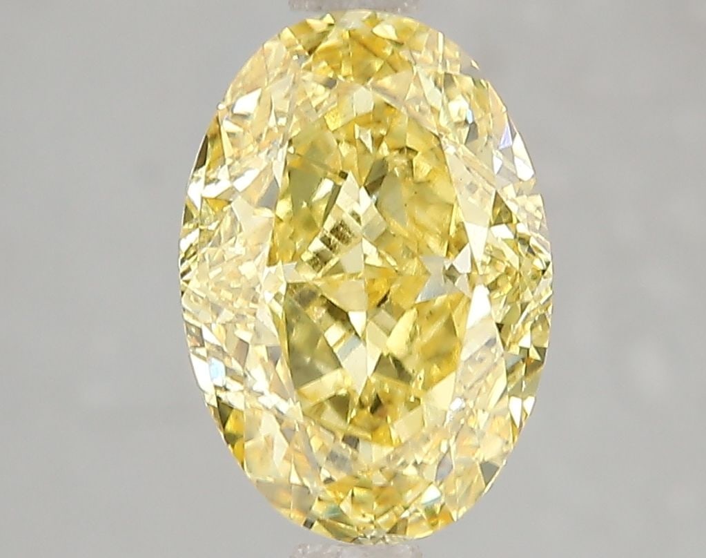 Loose Diamond - OVAL 3.1ct Fancy Vivid Yellow SI1: Loose Diamond - OVAL 3.1ct Fancy Vivid Yellow SI1 Source: This is a real non-mined Diamond that has been grown in a lab Shape: OVAL Carats: 3.1 Color: Fancy Vivid Yellow Certification: IGI Video: