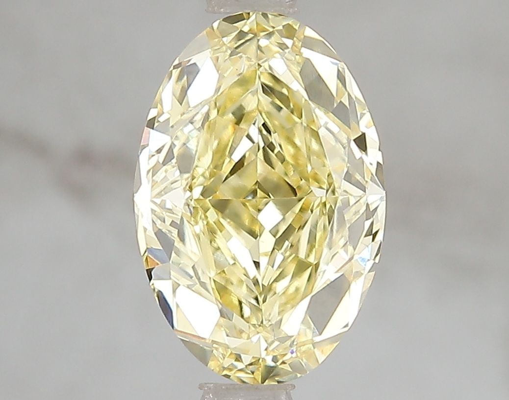 Loose Diamond - OVAL 2.6ct Fancy Vivid Yellow VS1: Loose Diamond - OVAL 2.6ct Fancy Vivid Yellow VS1 Source: This is a real non-mined Diamond that has been grown in a lab Shape: OVAL Carats: 2.6 Color: Fancy Vivid Yellow Certification: IGI Video: