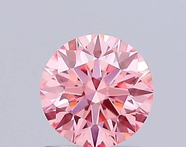 Ideal Loose Diamond - ROUND 1.05ct Fancy Vivid Pink VVS2: Ideal Loose Diamond - ROUND 1.05ct Fancy Vivid Pink VVS2 Source: This is a real non-mined Diamond that has been grown in a lab Shape: ROUND Carats: 1.05 Color: Fancy Vivid Pink Certification: IGI Vide
