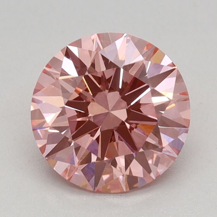 Ideal Loose Diamond - ROUND 0.92ct Fancy Vivid Pink VVS2: Ideal Loose Diamond - ROUND 0.92ct Fancy Vivid Pink VVS2 Source: This is a real non-mined Diamond that has been grown in a lab Shape: ROUND Carats: 0.92 Color: Fancy Vivid Pink Certification: IGI Vide