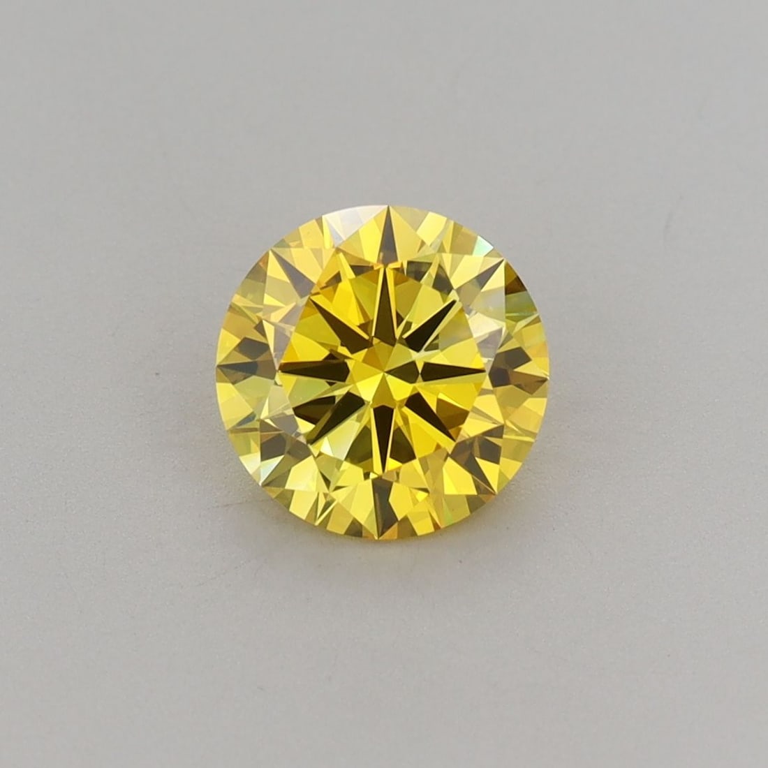 Loose Diamond - ROUND 1.2ct Fancy Vivid Yellow VVS2: Loose Diamond - ROUND 1.2ct Fancy Vivid Yellow VVS2 Source: This is a real non-mined Diamond that has been grown in a lab Shape: ROUND Carats: 1.2 Color: Fancy Vivid Yellow Certification: IGI Video: