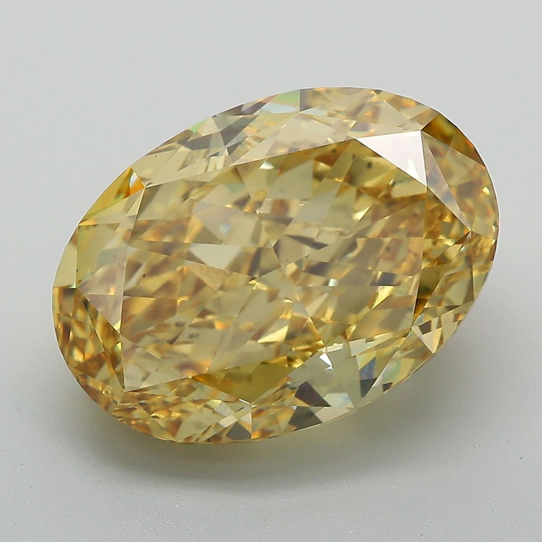 Loose Diamond - OVAL 11.83ct Fancy Vivid Yellow VS2: Loose Diamond - OVAL 11.83ct Fancy Vivid Yellow VS2 Source: This is a real non-mined Diamond that has been grown in a lab Shape: OVAL Carats: 11.83 Color: Fancy Vivid Yellow Certification: IGI Video: