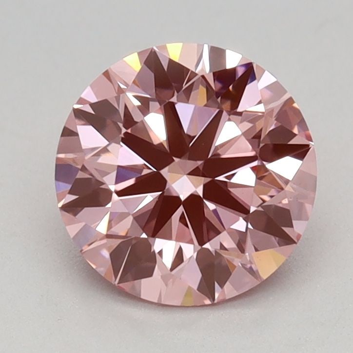 Ideal Loose Diamond - ROUND 0.96ct Fancy Vivid Pink VS1: Ideal Loose Diamond - ROUND 0.96ct Fancy Vivid Pink VS1 Source: This is a real non-mined Diamond that has been grown in a lab Shape: ROUND Carats: 0.96 Color: Fancy Vivid Pink Certification: IGI