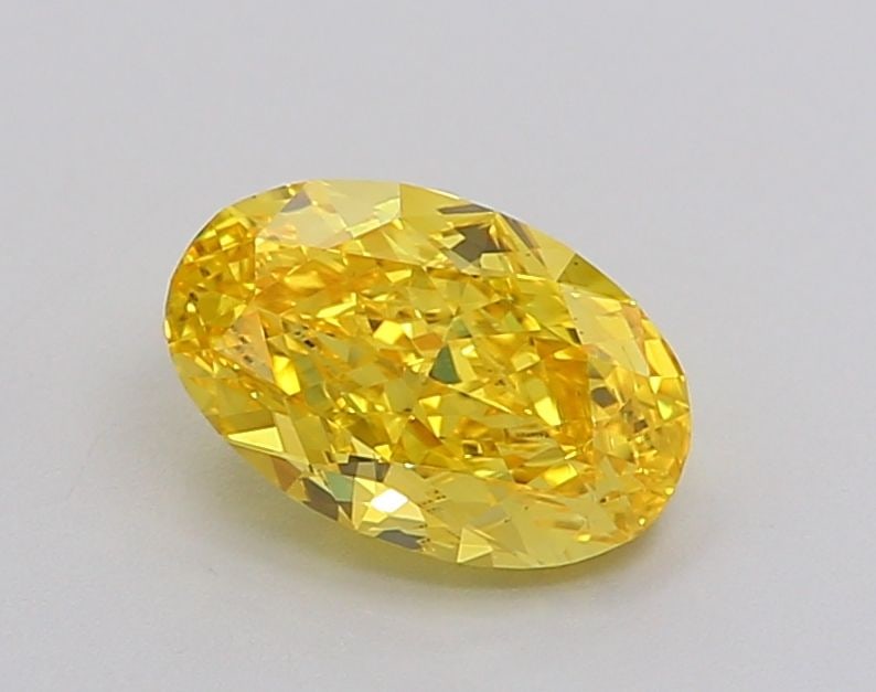 Loose Diamond - OVAL 0.95ct Fancy Vivid Yellow VS2: Loose Diamond - OVAL 0.95ct Fancy Vivid Yellow VS2 Source: This is a real non-mined Diamond that has been grown in a lab Shape: OVAL Carats: 0.95 Color: Fancy Vivid Yellow Certification: IGI Video: