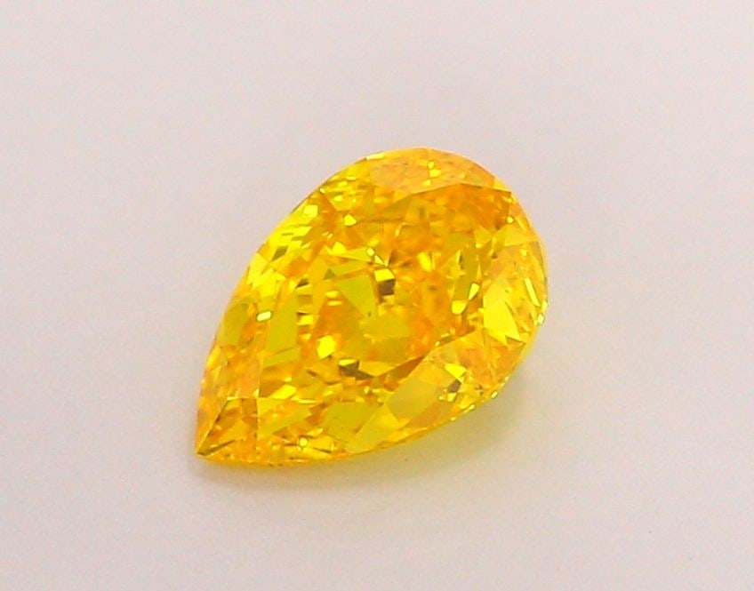 Loose Diamond - PEAR 1.03ct Fancy Vivid Orangey Yellow VS1: Loose Diamond - PEAR 1.03ct Fancy Vivid Orangey Yellow VS1 Source: This is a real non-mined Diamond that has been grown in a lab Shape: PEAR Carats: 1.03 Color: Fancy Vivid Orangey Yellow Certificatio