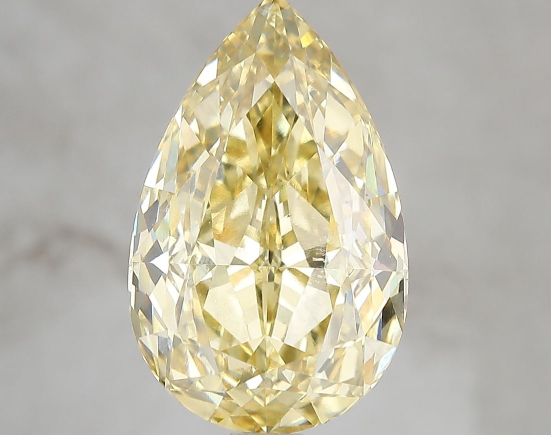 Loose Diamond - PEAR 7.09ct Fancy Vivid Yellow VS1: Loose Diamond - PEAR 7.09ct Fancy Vivid Yellow VS1 Source: This is a real non-mined Diamond that has been grown in a lab Shape: PEAR Carats: 7.09 Color: Fancy Vivid Yellow Certification: IGI Video: