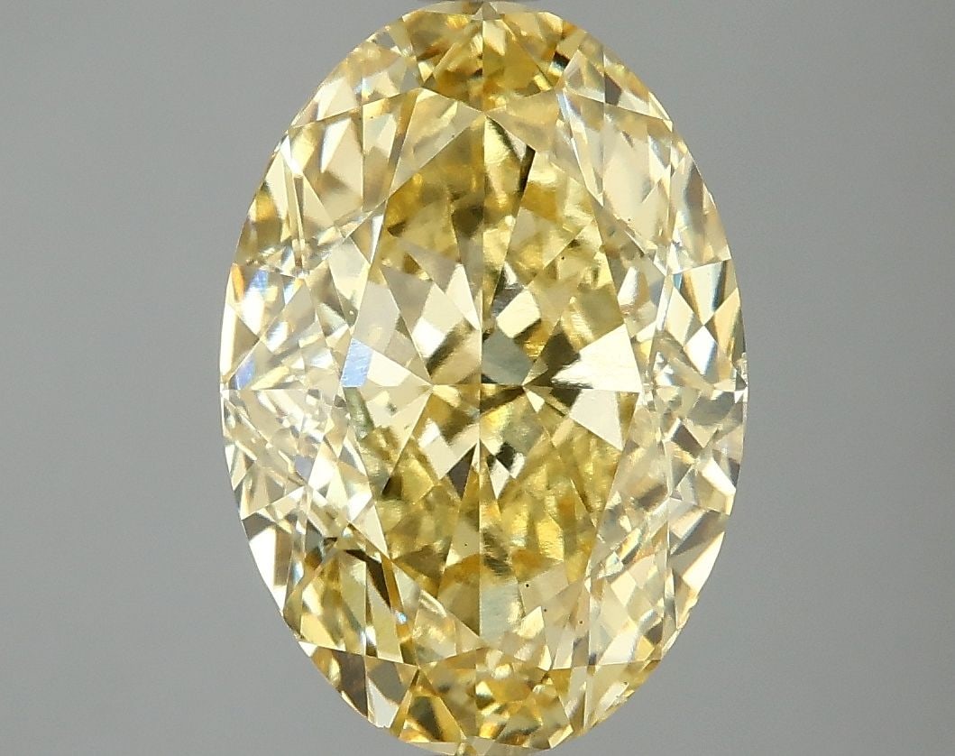 Loose Diamond - OVAL 5.1ct Fancy Vivid Yellow VS1: Loose Diamond - OVAL 5.1ct Fancy Vivid Yellow VS1 Source: This is a real non-mined Diamond that has been grown in a lab Shape: OVAL Carats: 5.1 Color: Fancy Vivid Yellow Certification: IGI Video: