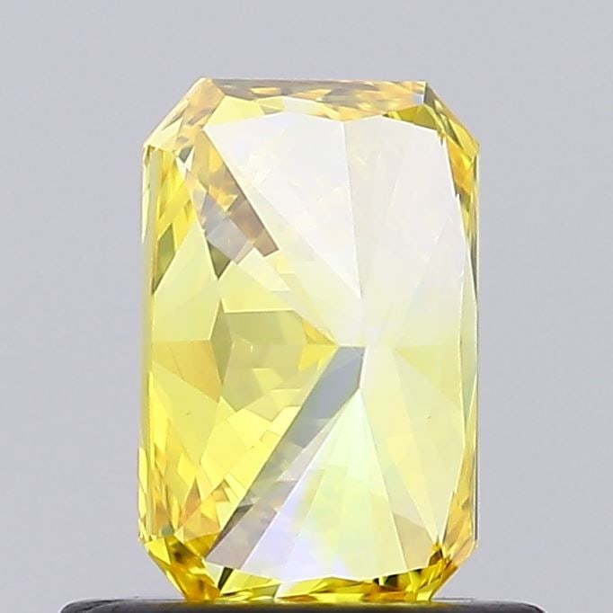 Loose Diamond - RADIANT 0.7ct Fancy Vivid Yellow VS1: Loose Diamond - RADIANT 0.7ct Fancy Vivid Yellow VS1 Source: This is a real non-mined Diamond that has been grown in a lab Shape: RADIANT Carats: 0.7 Color: Fancy Vivid Yellow Certification: IGI Video