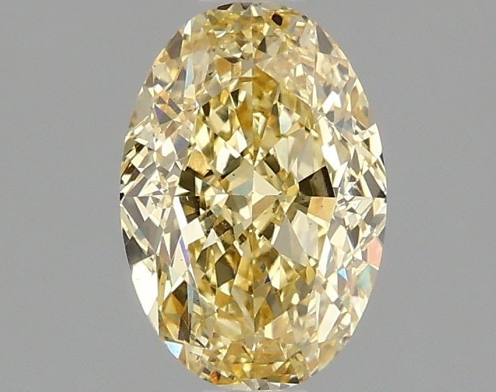 Loose Diamond - OVAL 1.52ct Fancy Vivid Yellow VS2: Loose Diamond - OVAL 1.52ct Fancy Vivid Yellow VS2 Source: This is a real non-mined Diamond that has been grown in a lab Shape: OVAL Carats: 1.52 Color: Fancy Vivid Yellow Certification: IGI Video: