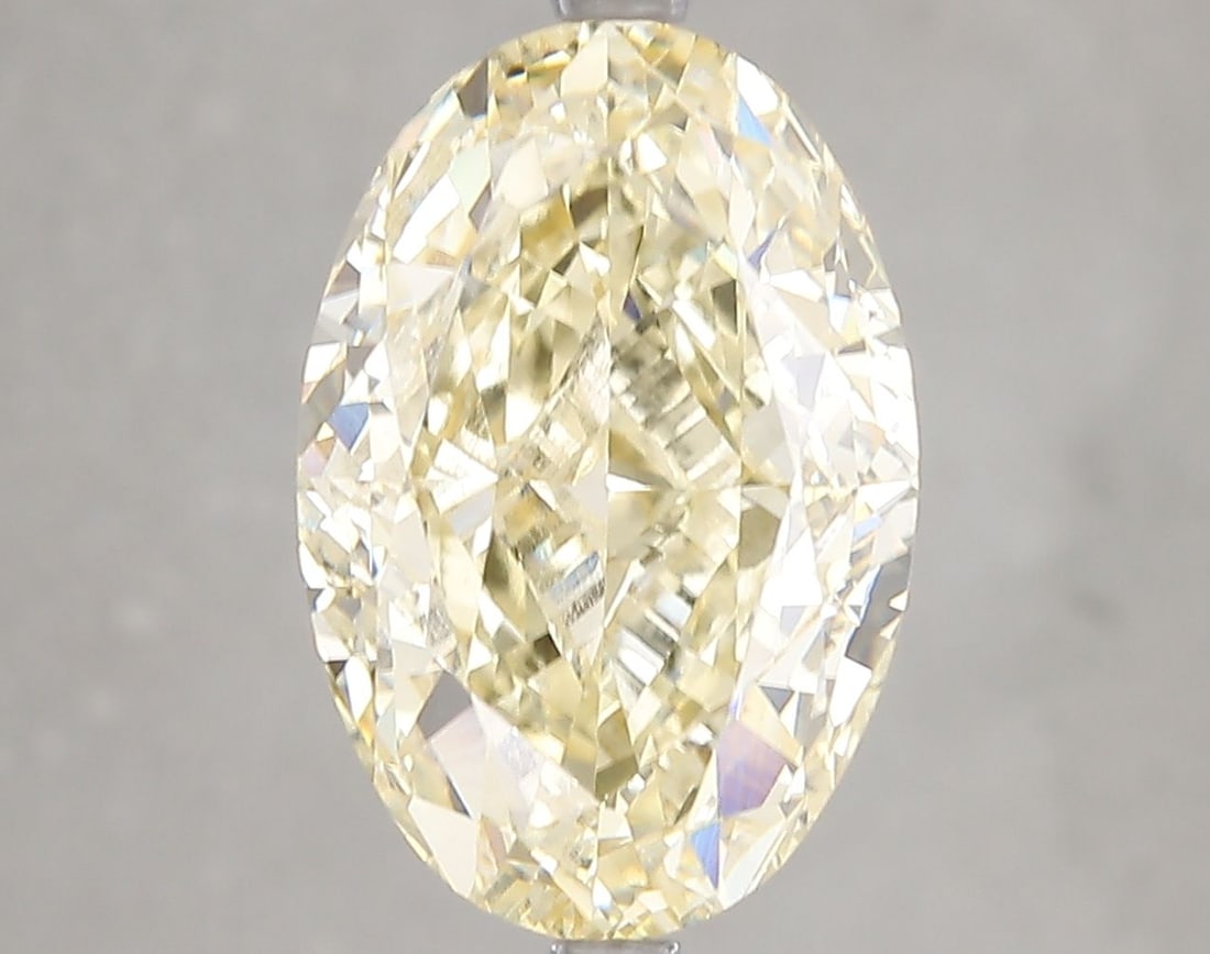 Loose Diamond - OVAL 7.04ct Fancy Yellow VS1: Loose Diamond - OVAL 7.04ct Fancy Yellow VS1 Source: This is a real non-mined Diamond that has been grown in a lab Shape: OVAL Carats: 7.04 Color: Fancy Yellow Certification: IGI Video: