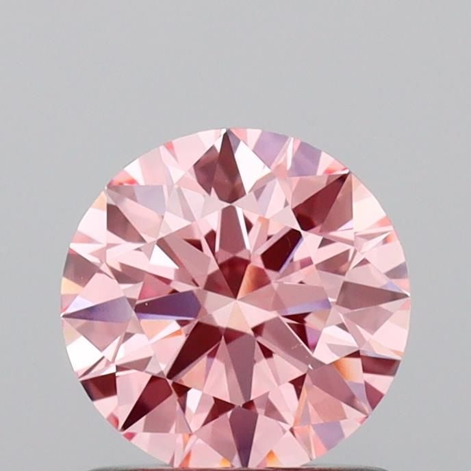 Ideal Loose Diamond - ROUND 0.9ct Fancy Vivid Pink VVS2: Ideal Loose Diamond - ROUND 0.9ct Fancy Vivid Pink VVS2 Source: This is a real non-mined Diamond that has been grown in a lab Shape: ROUND Carats: 0.9 Color: Fancy Vivid Pink Certification: IGI Video: