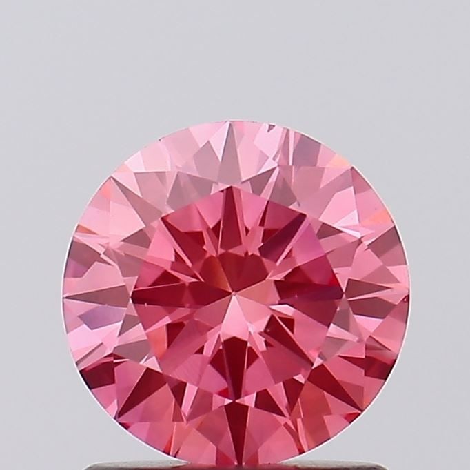 Loose Diamond - ROUND 1.08ct Fancy Vivid Pink VS1: Loose Diamond - ROUND 1.08ct Fancy Vivid Pink VS1 Source: This is a real non-mined Diamond that has been grown in a lab Shape: ROUND Carats: 1.08 Color: Fancy Vivid Pink Certification: IGI Video: