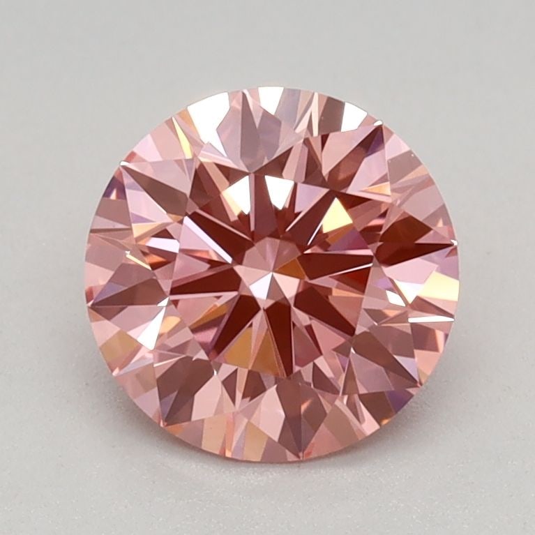 Ideal Loose Diamond - ROUND 0.93ct Fancy Vivid Pink VVS2: Ideal Loose Diamond - ROUND 0.93ct Fancy Vivid Pink VVS2 Source: This is a real non-mined Diamond that has been grown in a lab Shape: ROUND Carats: 0.93 Color: Fancy Vivid Pink Certification: IGI Vide