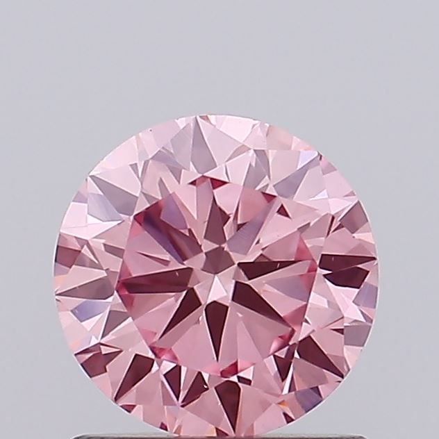 Loose Diamond - ROUND 0.81ct Fancy Vivid Pink VS1: Loose Diamond - ROUND 0.81ct Fancy Vivid Pink VS1 Source: This is a real non-mined Diamond that has been grown in a lab Shape: ROUND Carats: 0.81 Color: Fancy Vivid Pink Certification: IGI Video: