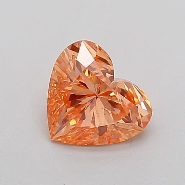 Loose Diamond - HEART 1.02ct Fancy Vivid Pinkish Orange SI1: Loose Diamond - HEART 1.02ct Fancy Vivid Pinkish Orange SI1 Source: This is a real non-mined Diamond that has been grown in a lab Shape: HEART Carats: 1.02 Color: Fancy Vivid Pinkish Orange Certificat