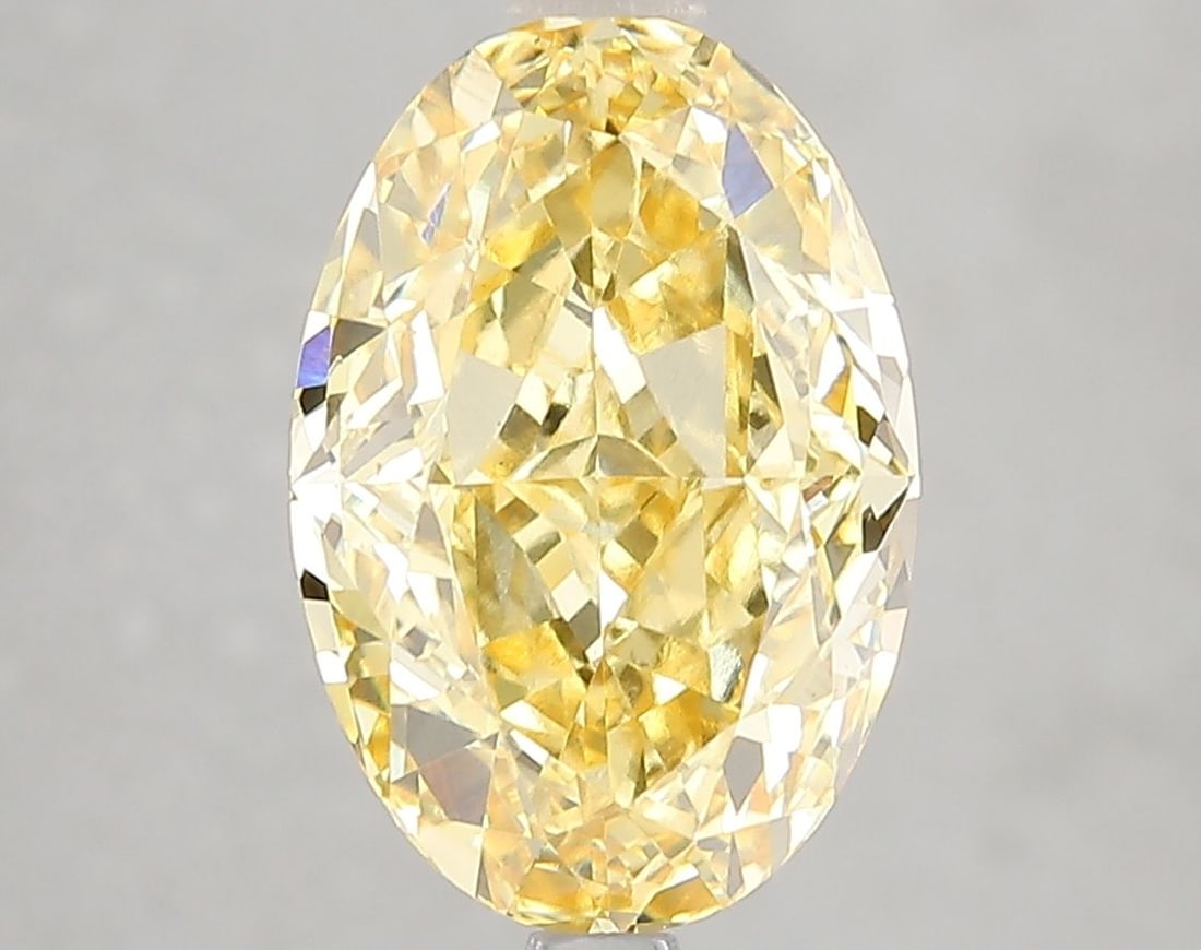 Loose Diamond - OVAL 4.61ct Fancy Vivid Yellow VVS2: Loose Diamond - OVAL 4.61ct Fancy Vivid Yellow VVS2 Source: This is a real non-mined Diamond that has been grown in a lab Shape: OVAL Carats: 4.61 Color: Fancy Vivid Yellow Certification: IGI Video: