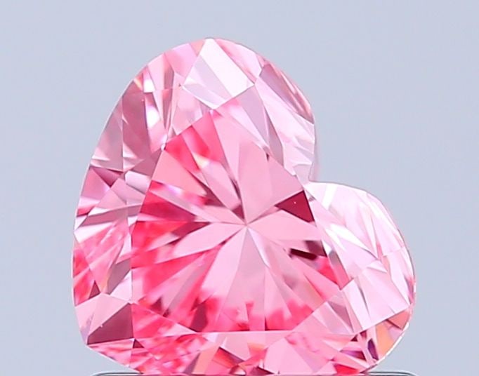 Loose Diamond - HEART 0.9ct Fancy Vivid Pink VVS2: Loose Diamond - HEART 0.9ct Fancy Vivid Pink VVS2 Source: This is a real non-mined Diamond that has been grown in a lab Shape: HEART Carats: 0.9 Color: Fancy Vivid Pink Certification: IGI Video: