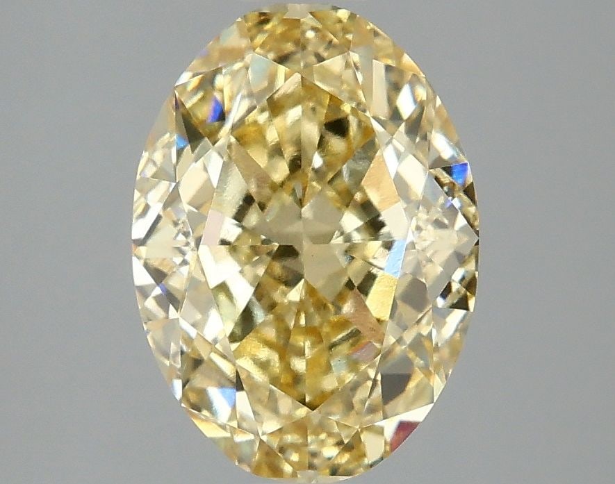 Loose Diamond - OVAL 3.08ct Fancy Vivid Yellow VS1: Loose Diamond - OVAL 3.08ct Fancy Vivid Yellow VS1 Source: This is a real non-mined Diamond that has been grown in a lab Shape: OVAL Carats: 3.08 Color: Fancy Vivid Yellow Certification: IGI Video: