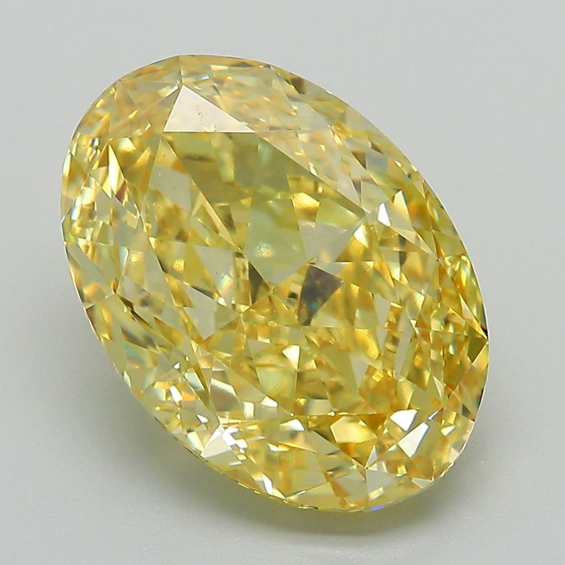 Loose Diamond - OVAL 6.14ct Fancy Vivid Yellow VVS2: Loose Diamond - OVAL 6.14ct Fancy Vivid Yellow VVS2 Source: This is a real non-mined Diamond that has been grown in a lab Shape: OVAL Carats: 6.14 Color: Fancy Vivid Yellow Certification: IGI Video: