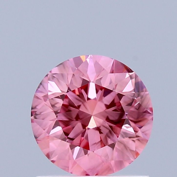 Loose Diamond - ROUND 0.97ct Fancy Vivid Pink SI1: Loose Diamond - ROUND 0.97ct Fancy Vivid Pink SI1 Source: This is a real non-mined Diamond that has been grown in a lab Shape: ROUND Carats: 0.97 Color: Fancy Vivid Pink Certification: IGI Video: