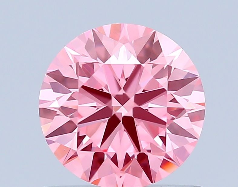 Ideal Loose Diamond - ROUND 0.81ct Fancy Vivid Pink VVS2: Ideal Loose Diamond - ROUND 0.81ct Fancy Vivid Pink VVS2 Source: This is a real non-mined Diamond that has been grown in a lab Shape: ROUND Carats: 0.81 Color: Fancy Vivid Pink Certification: IGI Vide