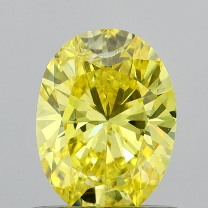 Loose Diamond - OVAL 0.56ct Fancy Vivid Yellow SI2: Loose Diamond - OVAL 0.56ct Fancy Vivid Yellow SI2 Source: This is a real non-mined Diamond that has been grown in a lab Shape: OVAL Carats: 0.56 Color: Fancy Vivid Yellow Certification: IGI Video:
