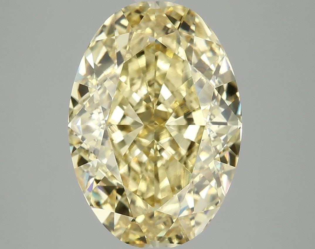 Loose Diamond - OVAL 5.09ct Fancy Vivid Yellow VS2: Loose Diamond - OVAL 5.09ct Fancy Vivid Yellow VS2 Source: This is a real non-mined Diamond that has been grown in a lab Shape: OVAL Carats: 5.09 Color: Fancy Vivid Yellow Certification: IGI Video: