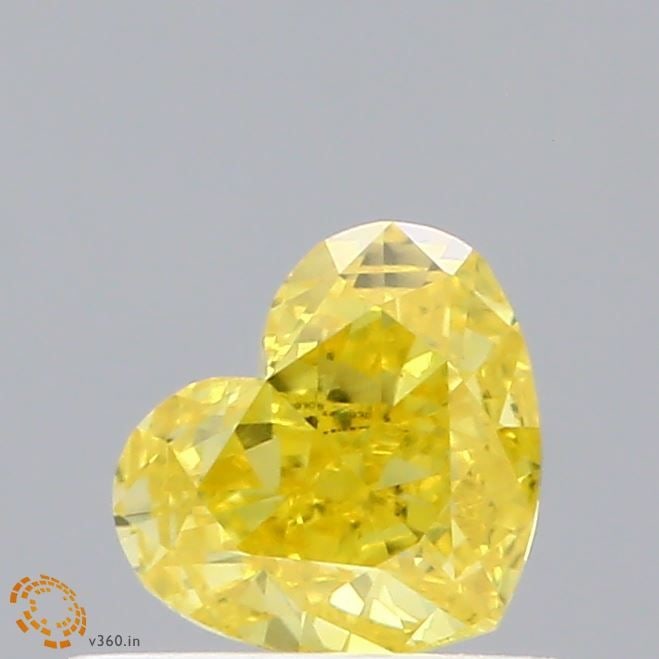 Loose Diamond - HEART 0.54ct Fancy Vivid Yellow VS1: Loose Diamond - HEART 0.54ct Fancy Vivid Yellow VS1 Source: This is a real non-mined Diamond that has been grown in a lab Shape: HEART Carats: 0.54 Color: Fancy Vivid Yellow Certification: IGI Video: