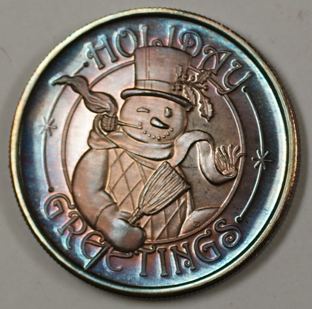 Holiday Greetings 1991 Pure Silver Medal Engraved with Kevin: Holiday Greetings 1991 Pure Silver Medal Engraved with Kevin This 1991 Holiday Greetings medal is crafted from pure silver and features beautiful coloring. The medal is engraved with the name "Kevin."