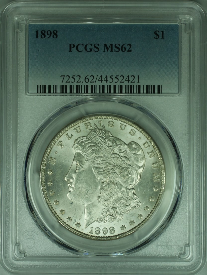 PCGS MS62 1898 Morgan Silver Dollar Philadelphia $1 Coin: PCGS MS62 1898 Morgan Silver Dollar Philadelphia $1 Coin This 1898 Morgan Silver Dollar coin is certified by PCGS with a grade of MS 62. Minted in Philadelphia, it is composed of silver and has a deno