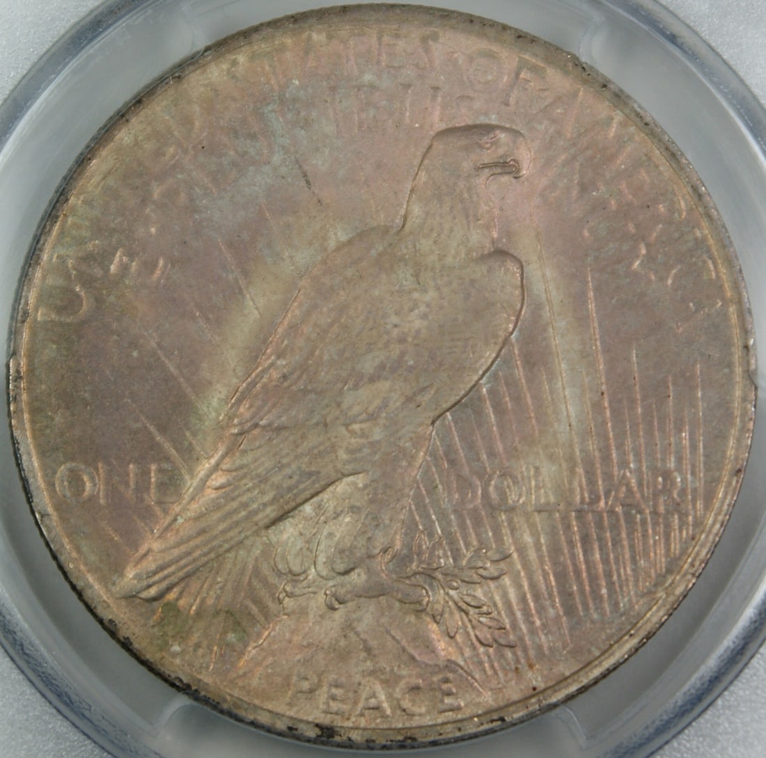 PCGS MS62 1923 Peace Dollar Uncirculated Pink Toned Reverse Philadelphia: PCGS MS62 1923 Peace Dollar Uncirculated Pink Toned Reverse Philadelphia This 1923 Peace Silver Dollar coin has been certified by PCGS with a grade of MS-62. The coin features a pink reverse toning an