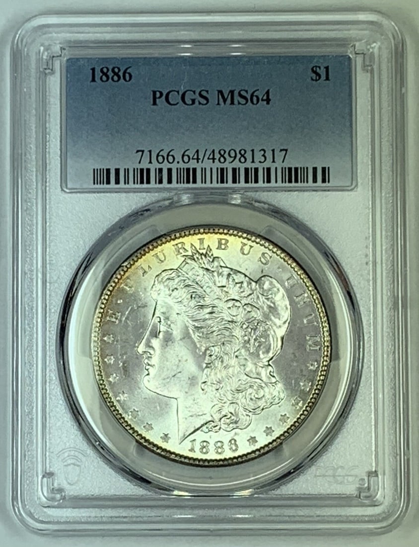 PCGS MS 64 1886 Morgan Silver Dollar Coin Certified Uncirculated: PCGS MS 64 1886 Morgan Silver Dollar Coin Certified Uncirculated This is an 1886 Morgan Silver Dollar coin graded MS 64 by PCGS. It is an uncirculated coin composed of silver and originates from the U