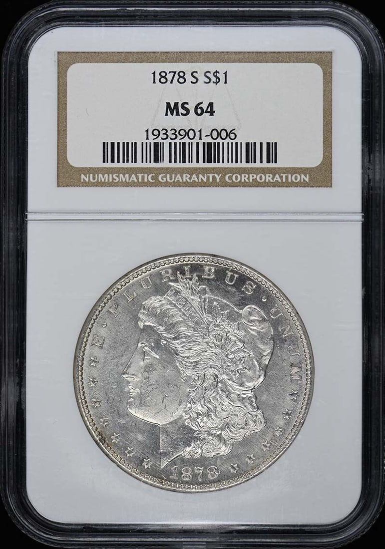 1878-S Morgan Dollar NGC MS64 Uncirculated Silver Coin: 1878-S Morgan Dollar NGC MS64 Uncirculated Silver Coin This 1878-S Morgan Dollar is a prized addition for collectors, showcasing its uncirculated condition with a grade of MS64, certified by NGC (Cert
